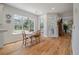 Bright dining area with hardwood floors, large windows, and a view of the backyard at 1032 Black Rush Cir, Mount Pleasant, SC 29466