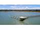 Aerial view of a private dock extending into calm blue waters, nestled in a serene coastal community at 1032 Black Rush Cir, Mount Pleasant, SC 29466