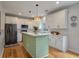 Bright kitchen featuring white cabinets, a center island, and stainless steel appliances at 1032 Black Rush Cir, Mount Pleasant, SC 29466