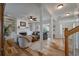 Open-concept living room with hardwood floors, fireplace, and staircase at 1032 Black Rush Cir, Mount Pleasant, SC 29466