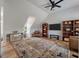 Bright and spacious living room with hardwood floors, comfortable seating, and decorative shelving at 1032 Black Rush Cir, Mount Pleasant, SC 29466