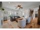 Spacious living room with large windows, hardwood floors, and a cozy seating area at 1032 Black Rush Cir, Mount Pleasant, SC 29466