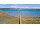 Expansive aerial view of a long pier stretching over intercoastal waterways with marshland at 1032 Black Rush Cir, Mount Pleasant, SC 29466