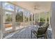 Inviting screened porch with stylish patterned flooring and comfortable seating, perfect for relaxation and enjoying the outdoors at 1032 Black Rush Cir, Mount Pleasant, SC 29466