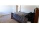 Comfortable bedroom with carpeted floors, a wooden bed frame, and neutral color palette at 112 Edisto Crossing Ct, Ridgeville, SC 29472
