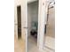 Walk-in closet featuring wire shelving, accessible storage solutions and a tiled shower in the background at 112 Edisto Crossing Ct, Ridgeville, SC 29472
