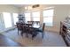 Open dining area with ample natural light and seating for eight at 112 Edisto Crossing Ct, Ridgeville, SC 29472