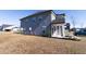 Stylish two-story home with gray siding, beautiful landscaping, and a well-maintained lawn at 112 Edisto Crossing Ct, Ridgeville, SC 29472