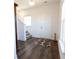 Inviting foyer with wood-look floors, a staircase, a patterned rug, and plenty of natural light at 112 Edisto Crossing Ct, Ridgeville, SC 29472
