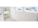 Bright laundry room features a utility sink, tile floor, and large windows offering neighborhood views at 112 Edisto Crossing Ct, Ridgeville, SC 29472
