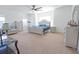 Spacious main bedroom features a ceiling fan, a telescope, and a large window providing natural light at 112 Edisto Crossing Ct, Ridgeville, SC 29472