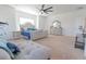 Bright main bedroom boasts a ceiling fan, ample space, and modern furniture at 112 Edisto Crossing Ct, Ridgeville, SC 29472