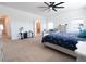 Spacious main bedroom with lots of natural light, neutral carpet and a ceiling fan at 112 Edisto Crossing Ct, Ridgeville, SC 29472