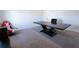 Office space with large desk, red gaming chair, and neutral carpet flooring at 112 Edisto Crossing Ct, Ridgeville, SC 29472