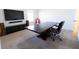 A spacious office space with large desk, modern decor, and neutral carpet at 112 Edisto Crossing Ct, Ridgeville, SC 29472