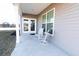 Inviting covered porch with rocking chairs, a perfect spot for enjoying the outdoors at 112 Edisto Crossing Ct, Ridgeville, SC 29472