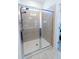 Modern, tiled shower with a glass enclosure and brushed nickel fixtures, a perfect retreat at 112 Edisto Crossing Ct, Ridgeville, SC 29472