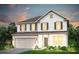 Charming two-story home with white siding, a two-car garage, and an inviting entrance at 115 Royal Cainhoy Way, Huger, SC 29450