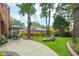 Beautiful backyard with a patio, lounge chair, lush green lawn, and mature trees for shade at 1278 Deep Water Dr, Mount Pleasant, SC 29464