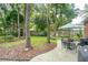 Lush backyard with mature trees, a paved patio area, and well-maintained landscaping at 1278 Deep Water Dr, Mount Pleasant, SC 29464
