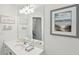 Bright bathroom with white vanity, large mirror, beach themed decor, and neutral walls at 1278 Deep Water Dr, Mount Pleasant, SC 29464