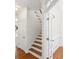 Bright foyer featuring wood floors, a staircase with wood treads, and white doors at 1278 Deep Water Dr, Mount Pleasant, SC 29464