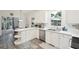 Charming kitchen with white cabinetry, stainless appliances, and breakfast bar seating at 1278 Deep Water Dr, Mount Pleasant, SC 29464