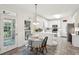 Eat-in kitchen with white cabinets, tile floors, and natural lighting at 1278 Deep Water Dr, Mount Pleasant, SC 29464