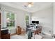 Bright home office with two large windows, ceiling fan, and glass top desk with dual monitors at 1278 Deep Water Dr, Mount Pleasant, SC 29464
