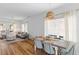 Open-concept living and dining area with hardwood floors and modern lighting at 1322 Addykay Pl, North Charleston, SC 29406