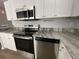 Modern kitchen with stainless steel appliances and stylish countertops at 1411 Telfair Way, Charleston, SC 29412