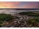 Breathtaking aerial view of the serene waterway and winding tidal creeks at sunset at 1420 Polly Point Rd, Wadmalaw Island, SC 29487