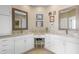 Elegant bathroom with dual vanities, granite countertops, and white cabinets, offering ample storage and style at 1420 Polly Point Rd, Wadmalaw Island, SC 29487