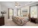 Inviting bedroom with soft carpet, floral bedding, and ambient lighting perfect for unwinding after a long day at 1420 Polly Point Rd, Wadmalaw Island, SC 29487