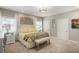 Comfortable bedroom features a queen bed, bedside table, and bench, creating a cozy and inviting atmosphere at 1420 Polly Point Rd, Wadmalaw Island, SC 29487