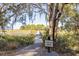 Scenic community dock with tree coverage and marsh views, offering a serene environment at 1420 Polly Point Rd, Wadmalaw Island, SC 29487