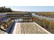 Scenic community pier with a bench overlooking the marsh, providing a tranquil spot for relaxation at 1420 Polly Point Rd, Wadmalaw Island, SC 29487