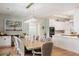 Elegant dining room featuring a long table, chandelier lighting and stylish decor at 1420 Polly Point Rd, Wadmalaw Island, SC 29487