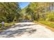 Long driveway leading to a secure gated entrance ensuring privacy and exclusivity at 1420 Polly Point Rd, Wadmalaw Island, SC 29487