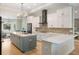 Spacious kitchen featuring a large island, modern appliances and stylish finishes at 1420 Polly Point Rd, Wadmalaw Island, SC 29487