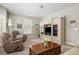 Cozy living room with plush recliners, natural light, and a wooden coffee table at 1420 Polly Point Rd, Wadmalaw Island, SC 29487