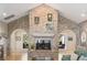 Cozy living room with a striking brick fireplace and views into adjacent rooms at 1420 Polly Point Rd, Wadmalaw Island, SC 29487