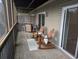 Cozy covered balcony with comfortable seating, perfect for relaxation at 1530 Fort Johnson Rd # 3F, Charleston, SC 29412