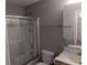 Well-lit bathroom featuring a shower with glass doors, neutral walls, modern fixtures, and ample counter space at 1530 Fort Johnson Rd # 3F, Charleston, SC 29412