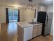 Bright kitchen features stainless steel appliances and a breakfast bar at 1530 Fort Johnson Rd # 3F, Charleston, SC 29412
