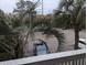 Balcony view showcasing ample parking with palm trees providing shade and a tropical touch at 1530 Fort Johnson Rd # 3F, Charleston, SC 29412