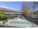Community pool with fencing and lounge chairs at this well-maintained condo building at 1530 Fort Johnson Rd # 3F, Charleston, SC 29412