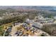 Aerial view of a neighborhood with modern apartments, houses, and a pond at 1532 Roustabout Way, Charleston, SC 29414
