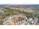 Scenic aerial view of a neighborhood featuring well-maintained homes, a pond, and mature trees at 1532 Roustabout Way, Charleston, SC 29414