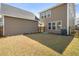 A fenced-in backyard showing the home's exterior with ample space for outdoor enjoyment at 1532 Roustabout Way, Charleston, SC 29414